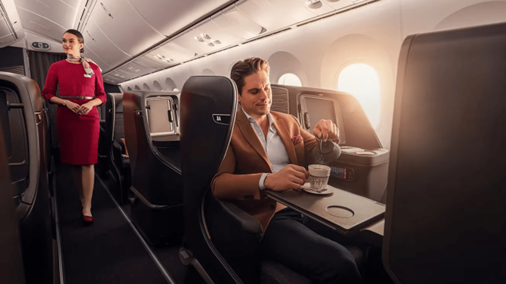 Business Class cabin — flatbed seat with dining service in progress (Turkish Airlines)
