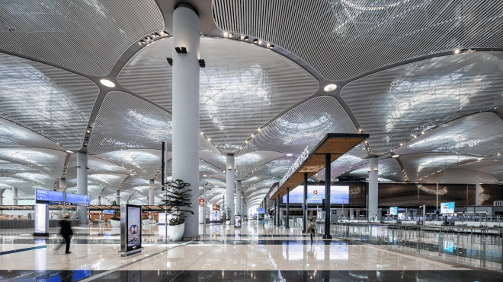 Istanbul Airport interior — modern terminal, natural light, passenger flow (Turkish Airlines)