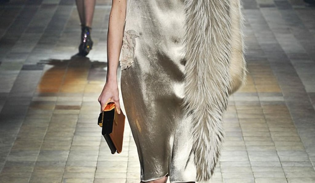 Alber Elbaz wanted to include words in the autumn/winter collection. The models came out on the runway wearing necklaces that spelled words such as HOT, HELP, COOL or LOVE.