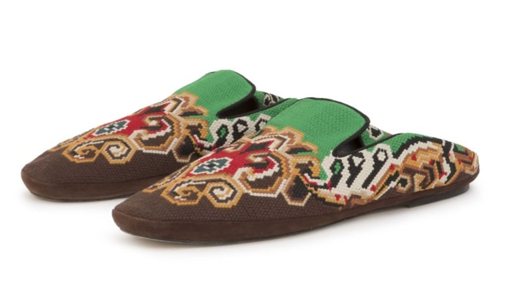 Embroidered slippers featuring a round toe, a slip-on style and a fold-down back boast a colourful vibe. Embroidered slippers featuring a round toe, a slip-on style and a fold-down back boast a colourful vibe.