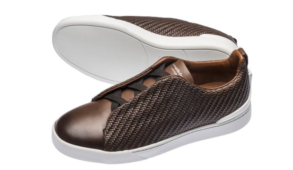 The Ermenegildo Zegna Couture PELLE TESSUTA formal sneakers look sharp with tailored suits.