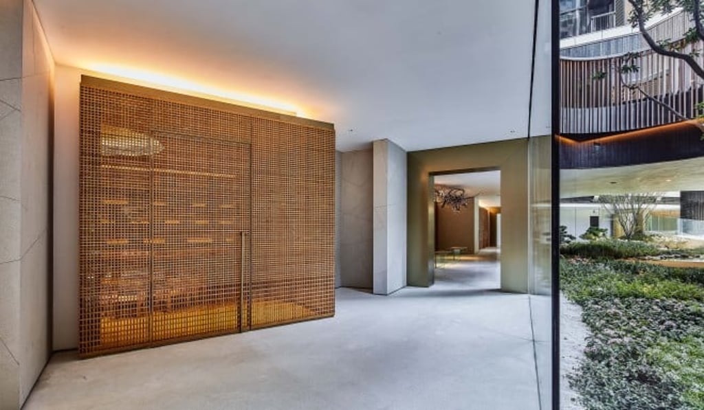 A hand-crafted gridded wooden screen creates a space that feels both open and secluded at the same* A hand-crafted gridded wooden screen creates a space that feels both open and secluded at the same*