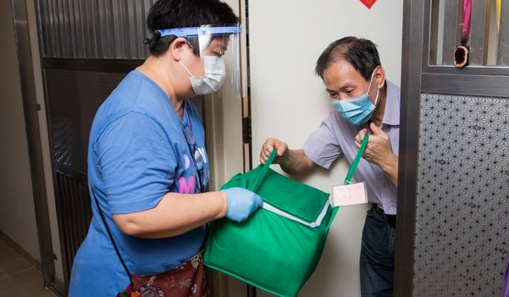 A volunteer worker delivers fresh food to the needy through the St. James Settlement FOOD-CO food programme funded by TrustTomorrow.