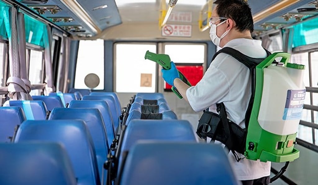 Staff from Germagic disinfecting a school bus.