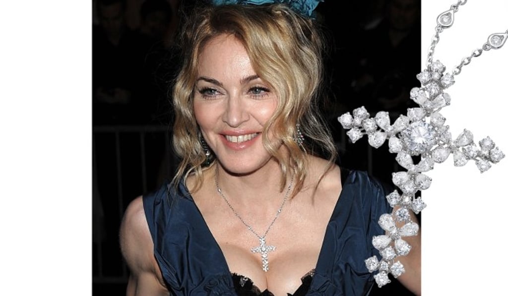 Madonna wears the Edelweiss Cross diamond pendant to the Met Gala in 2009.