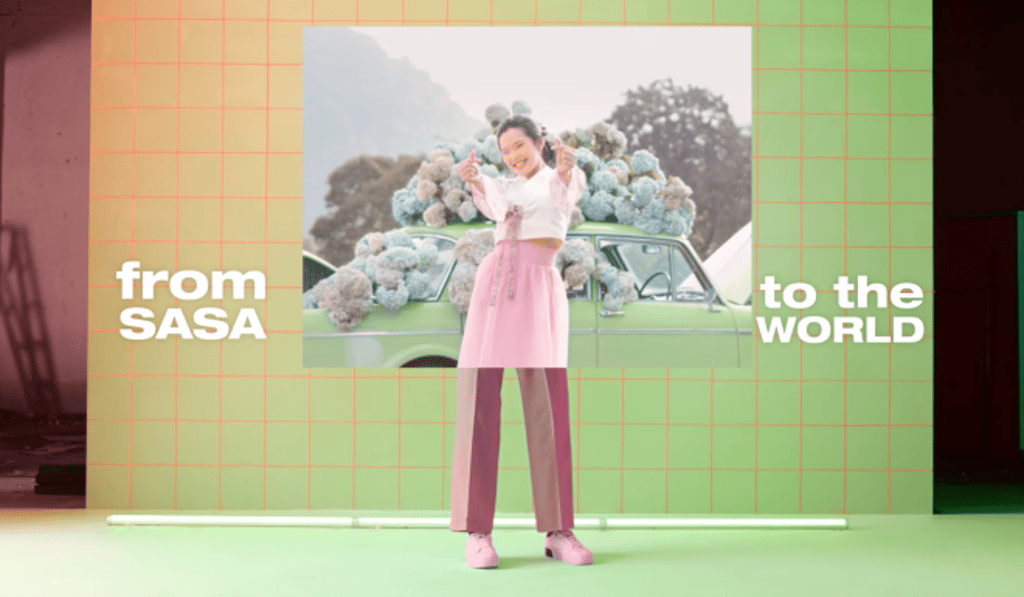 The video features performers and lyrics from various countries around the world, including Korea