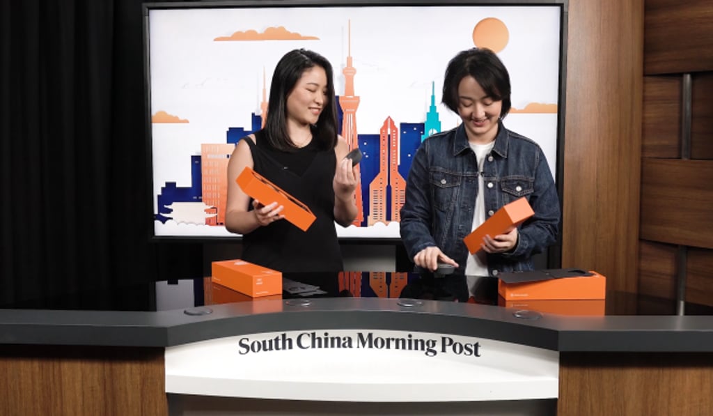 Goldthread's Victoria Ho (right) and Tiffany Ip unboxing the Alibaba Cloud Pin, a new wearable device offered only to media professionals working at Tokyo 2020. Goldthread's Victoria Ho (right) and Tiffany Ip unboxing the Alibaba Cloud Pin, a new wearable device offered only to media professionals working at Tokyo 2020.