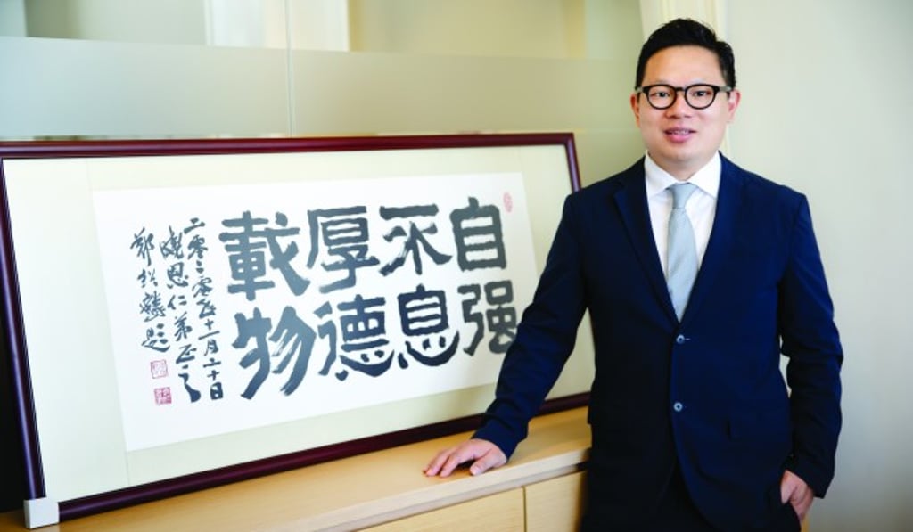 Lam displays a Chinese calligraphy piece by his teacher, and famous calligrapher, Cheng Siu-lun, in a prominent place in his office, to remind himself to strive for self-improvement all the time. Lam displays a Chinese calligraphy piece by his teacher, and famous calligrapher, Cheng Siu-lun, in a prominent place in his office, to remind himself to strive for self-improvement all the time.