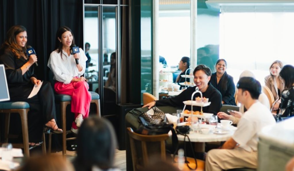 The audience and speakers engage in a lively debate. The audience and speakers engage in a lively debate.