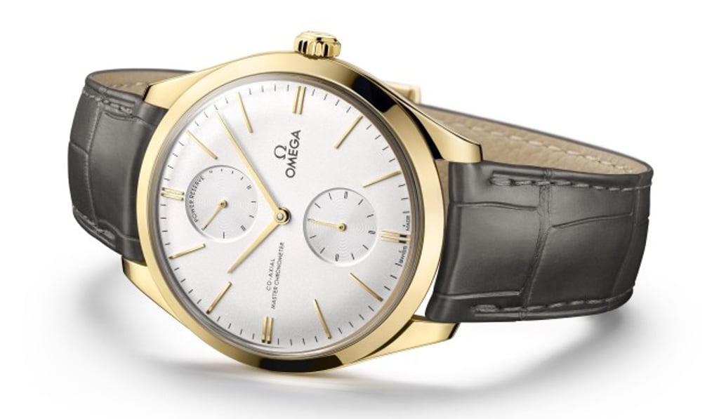 Omega’s new Master Chronometer-certified De Ville Trésor Power Reserve watch for men is available in yellow gold with a grey leather strap. Photo: Omega