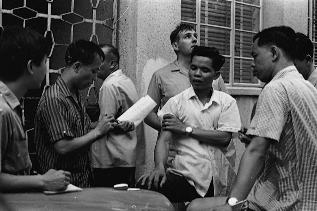 Police officers at the scene of a bomb explosion in North Point on August 20, 1967, which killed Wong Siu-fan, two, and his sister Wong Yee-man, eight, and turned public opinion against the terrorists.