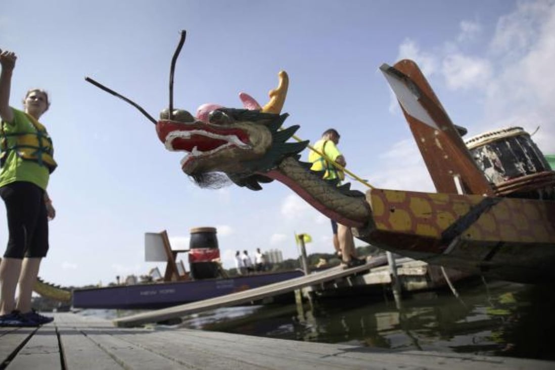 An entrant in the Hong Kong Dragon Boat Festival in Queens, New York. Photo: AP
