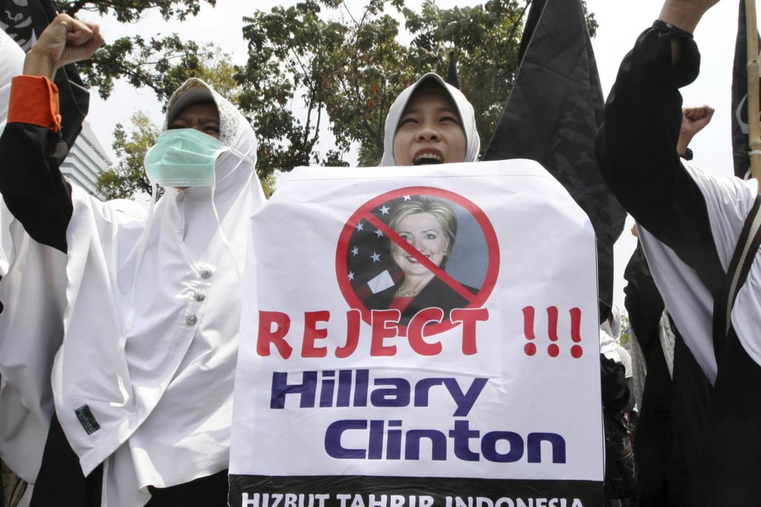 Muslim women protest against the visit of US Secretary of State Hillary Rodham Clinton outside the US embassy in Jakarta. Photo: AP