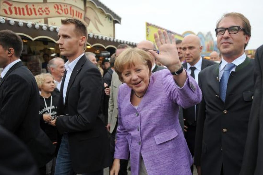 German Chancellor Angela Merkel arrives for the 'political morning pint' event at the Gillamoos fair in Abensberg, southern Germany. Photo: AFP 