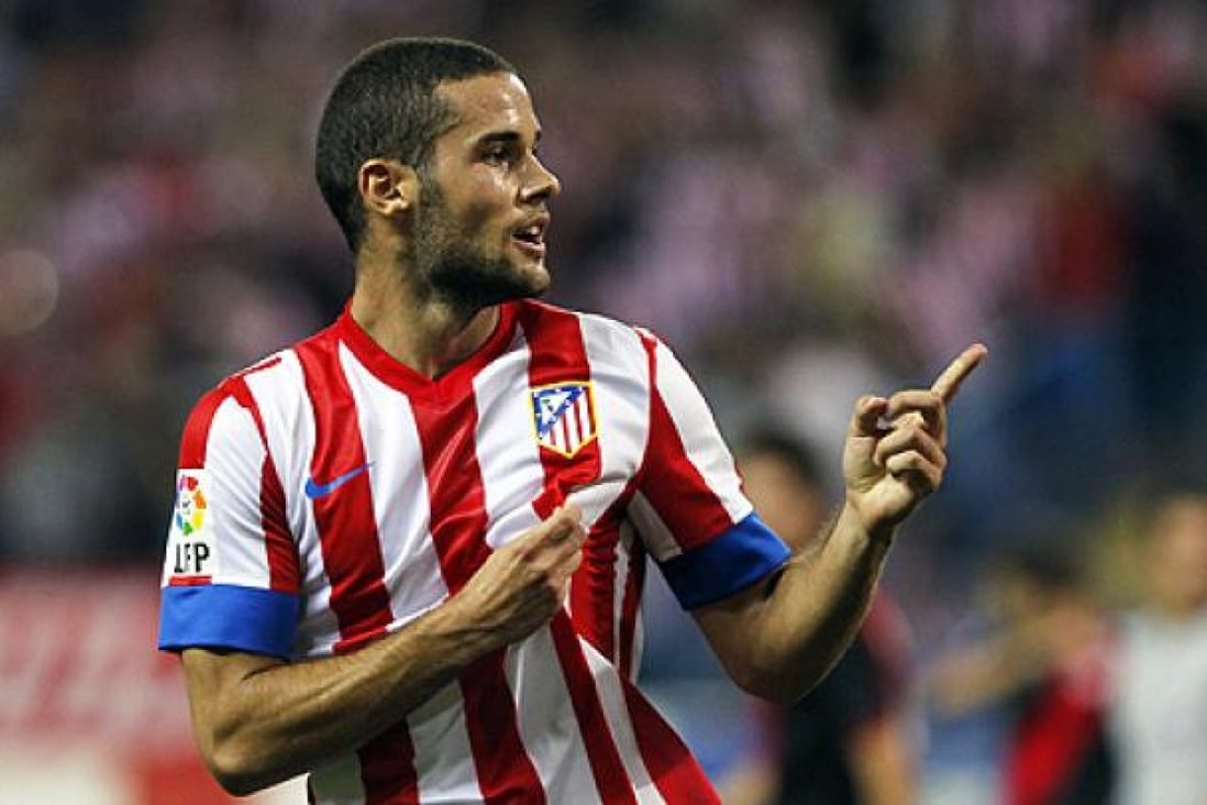 Atletico Madrid's Mario Suarez celebrates his goal, the only one in the first-half of that match against Rayo Vallecano on Sunday. Photo: AP