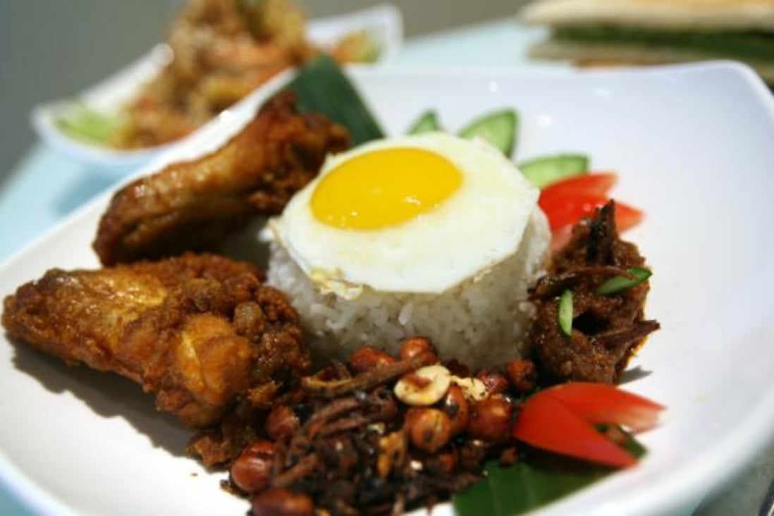 The most popular meal to start the day is nasi lemak, Malaysia's national dish.