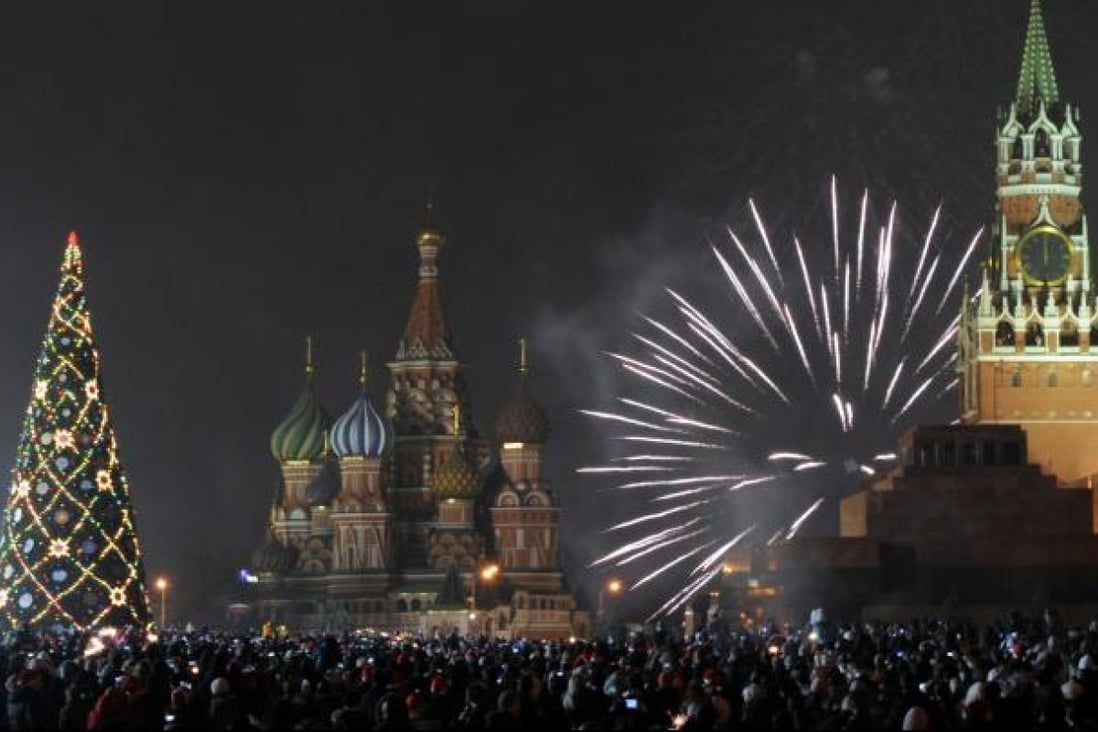 Fireworks explode over St. Basil cathedral at the Red Square in Moscow, early on January 1, 2012. Photo: AFP