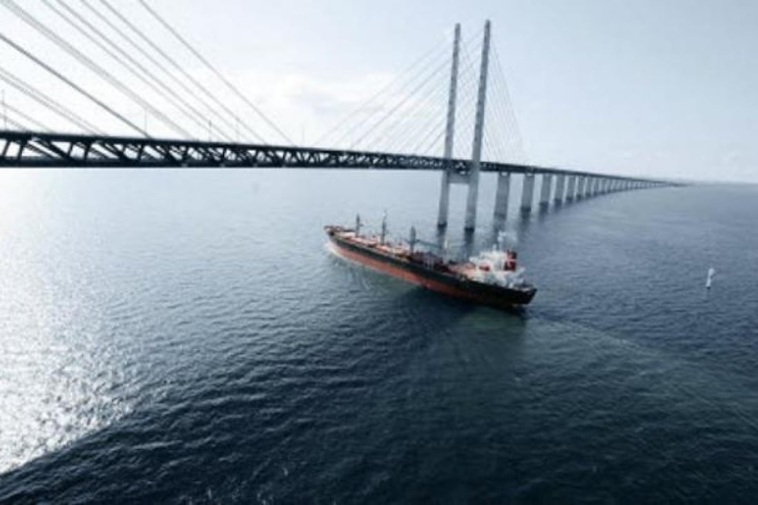 A Lauritzen ship sails under the 7,845-metre Oresund Bridge, the longest road and rail bridge in Europe, which connects Sweden and Denmark.