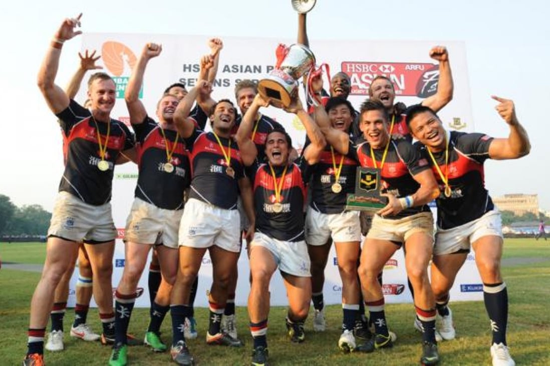 Hong Kong's victorious team celebrate after defeating Japan in the final to win the Mumbai Sevens. The victory makes Hong Kong the top sevens side in Asia. Photo: SCMP