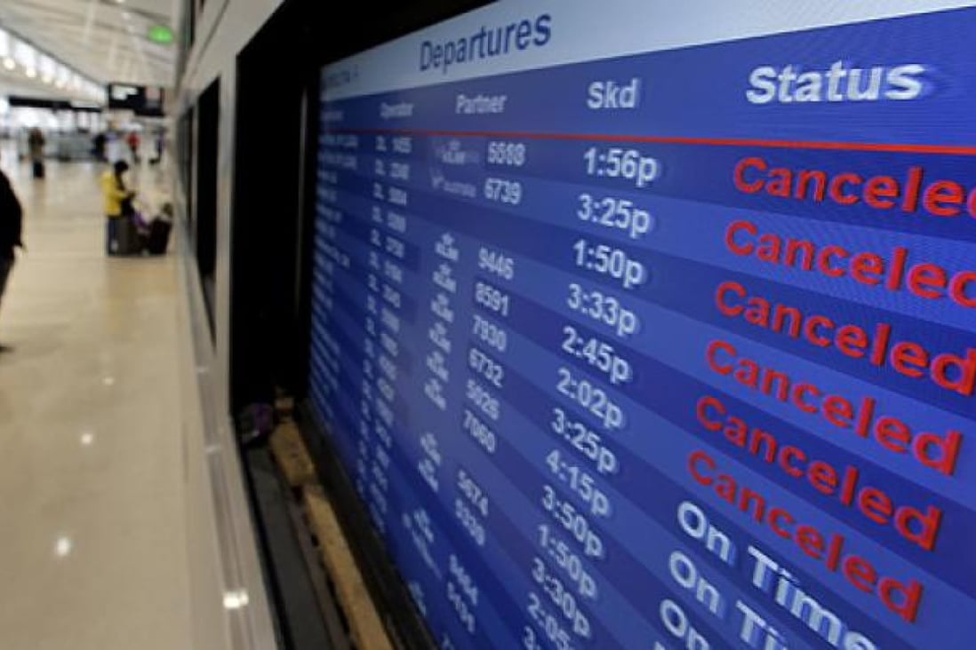 Nearly 15,000 flights were grounded as storm Sandy continued on its path on Monday. Photo: AP