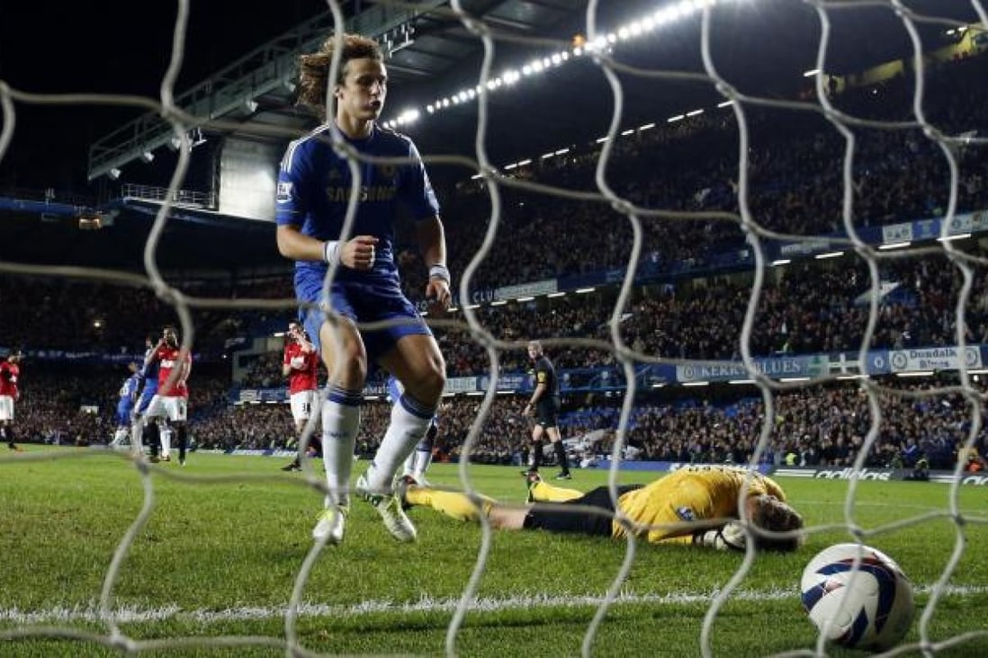 Chelsea's David Luiz celebrates after scoring a penalty past Manchester United goalkeeper Anders Lindegaard in a League Cup match the Blues won 5-4. Photo: AP