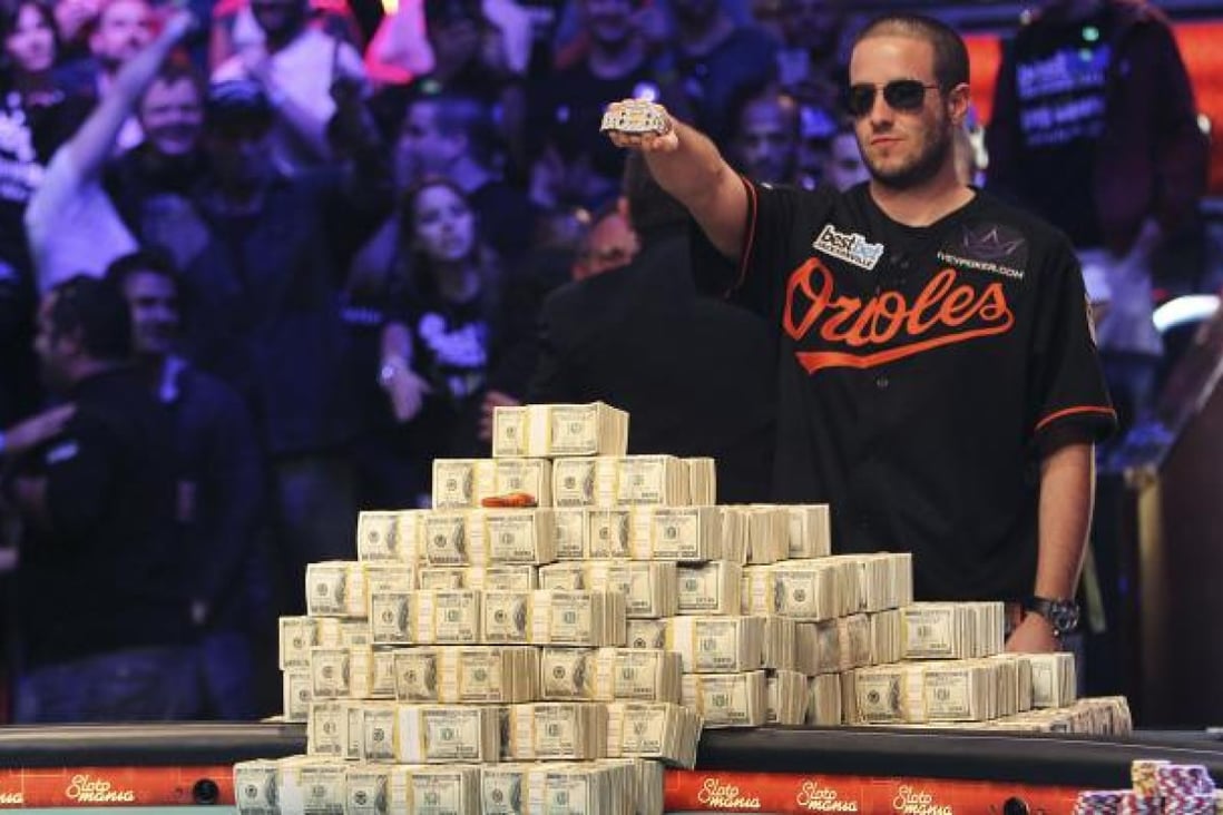 Greg Merson holds up his new bracelet after winning the World Series of Poker No-Limit Hold'em Main Event. Photo: AP