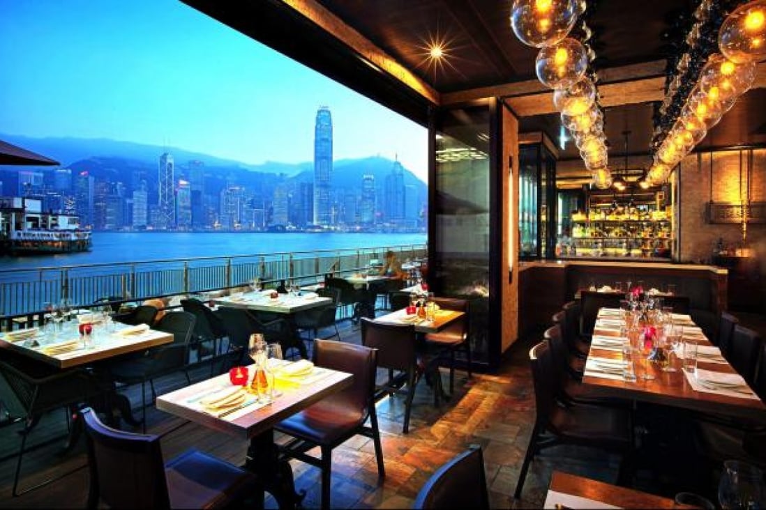 AL MOLO RESTAURANT HAS A BUSY ATMOSPHERE AND GREAT VIEWS OF HONG KONG ISLAND, WHEN THE QUAY IS EMPTY