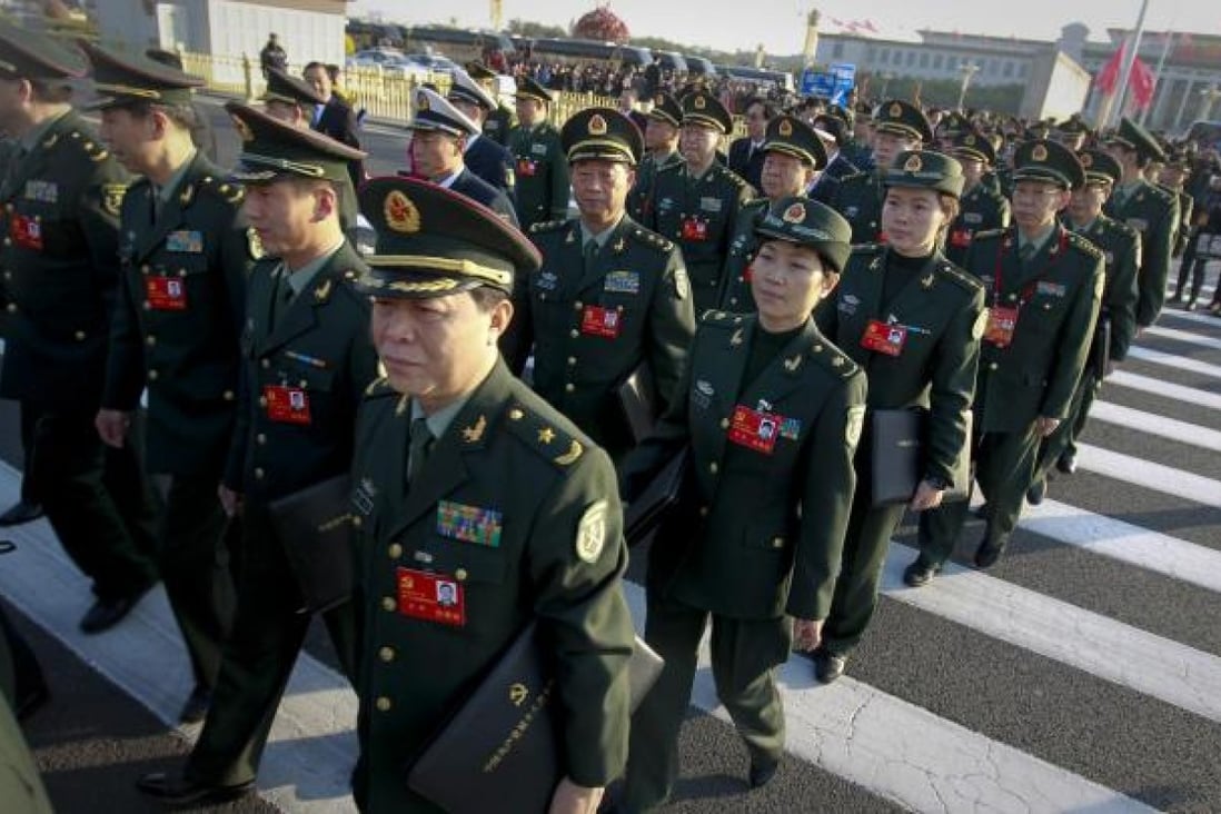 PLA delegates walk towards the Great Hall of the People during the recent Communist Party Congress held in Beijing. Photo: EPA