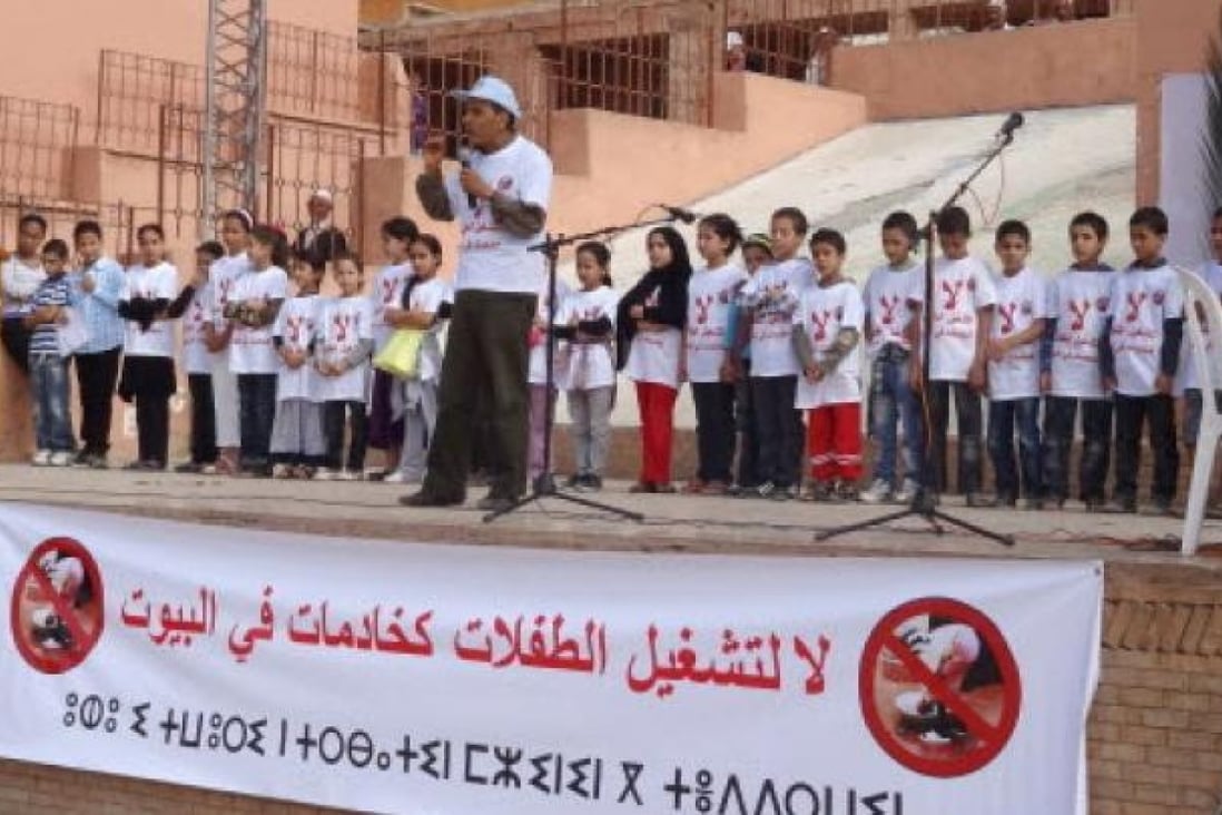 A recent meeting against the use of under-15 aged girls as domestic servants in Imintanoute, southwest of Marrakech, Morocco. A new report says the country still needs to do more to reduce the number of girls working as domestic servants. Photo: AP. 