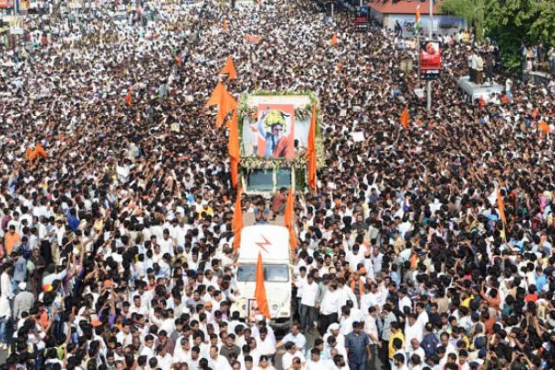 Indians attend the funeral procession of Bal Thackeray in Mumbai on Sunday. Photo: Xinhua