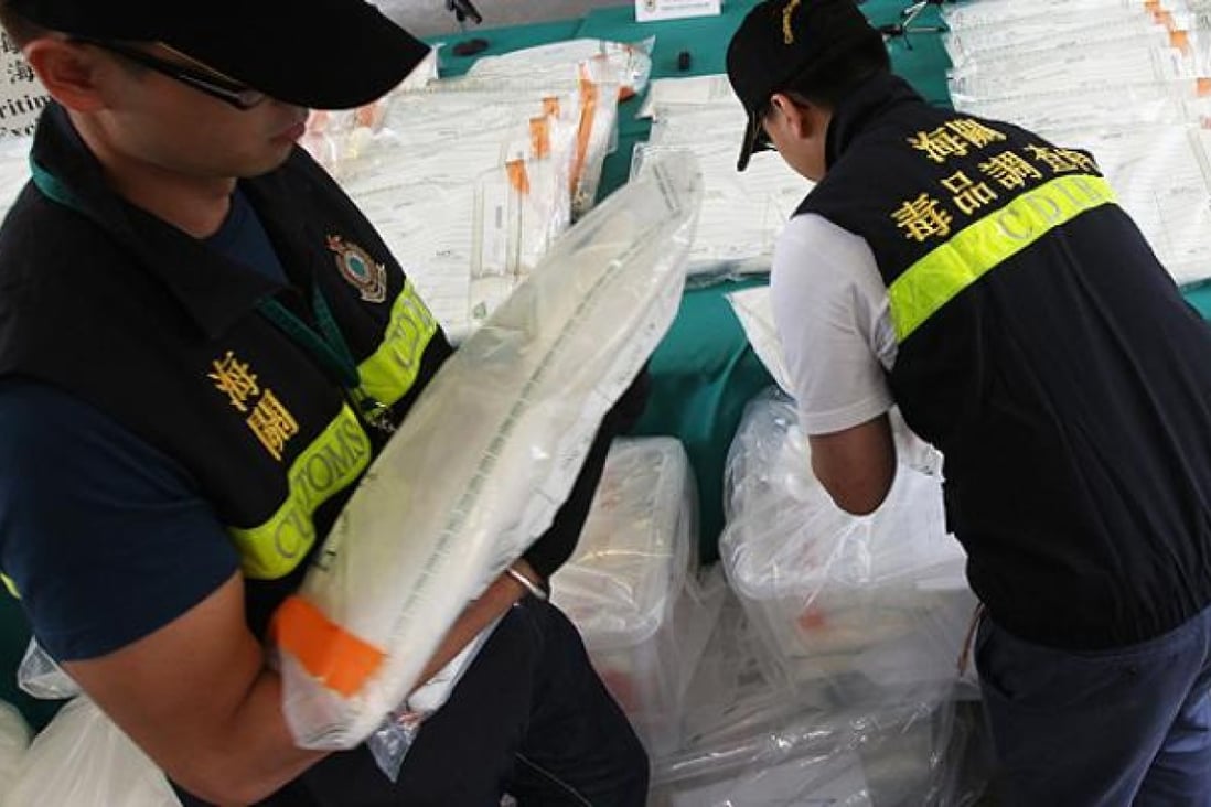 Customs officers show their biggest seizure of 412kg of ketamine with a street value of HK$47 million at its Kwai Chung Customhouse on June 1. Photo: David Wong