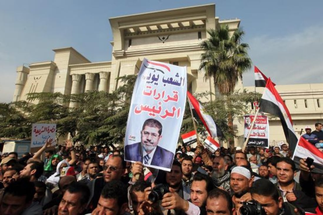 Egypt's top court postponed a hearing that could see the country's Islamist-controlled constituent assembly and upper house of parliament dissolved, after thousands of Islamist protesters surrounded the court building in Cairo.