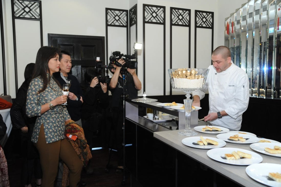 Chef Ryan Clift cooks scrambled eggs with white truffle at Hullett House during the "white diamond" adventure in Hong Kong.