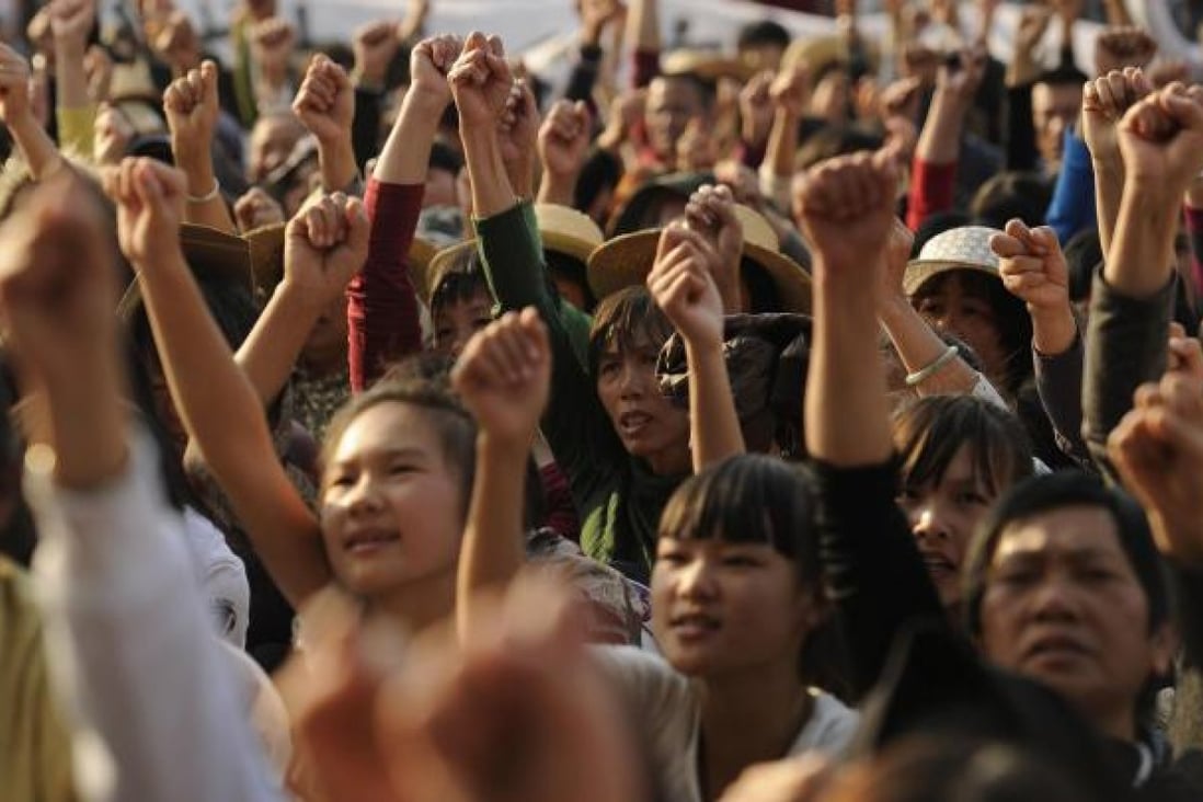 Residents of Wukan rally over illegal land grabs. Photo: AFP
