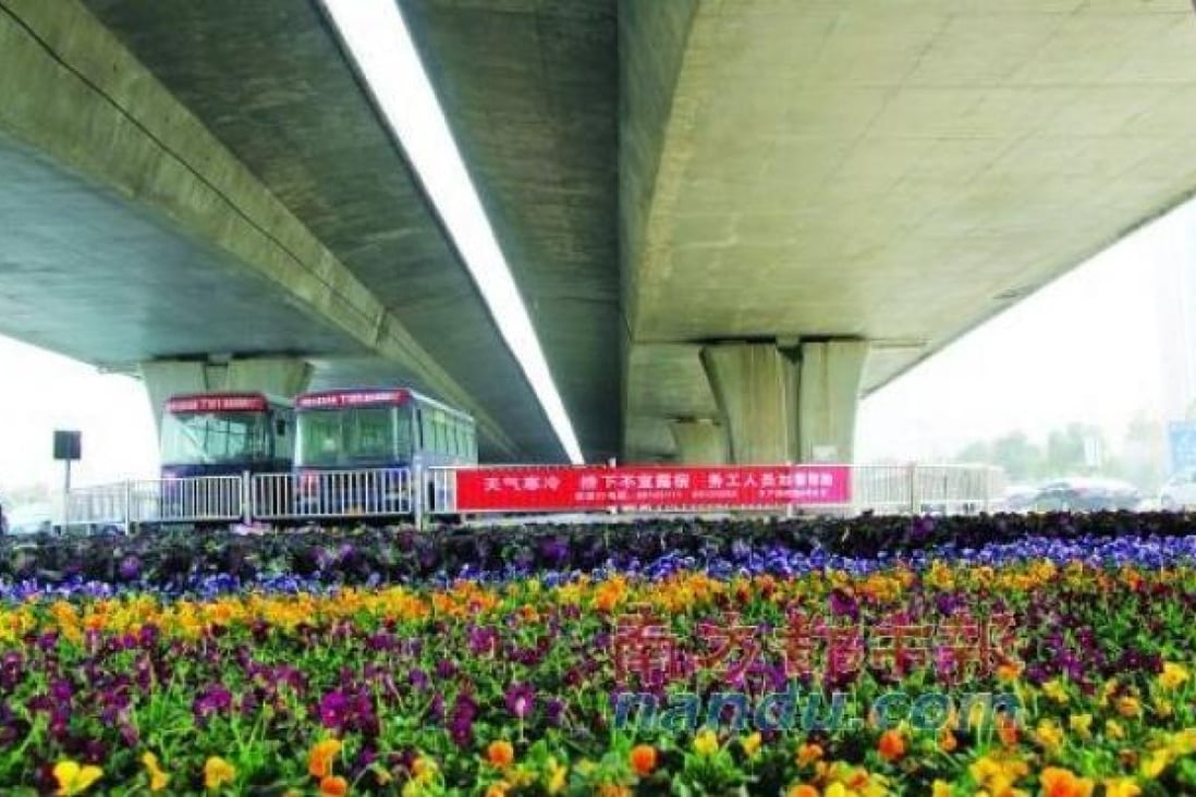 Hundreds of flower pots fill the space beneath an express bridge at the Nongye Road intersection in Zhengzhou. Picture: SCMP Pictures