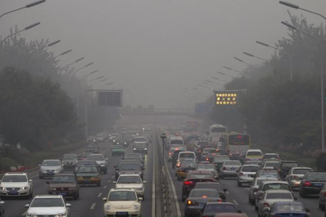 Another smoggy day on the roads of Beijing. Photo: Simon Song