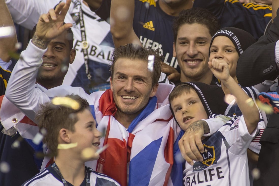 David Beckham celebrates his LA Galaxy end of season win with his sons on December 1, 2012. Galaxy won 3-1 to win the MLS Cup Championship. Photo: Xinhua