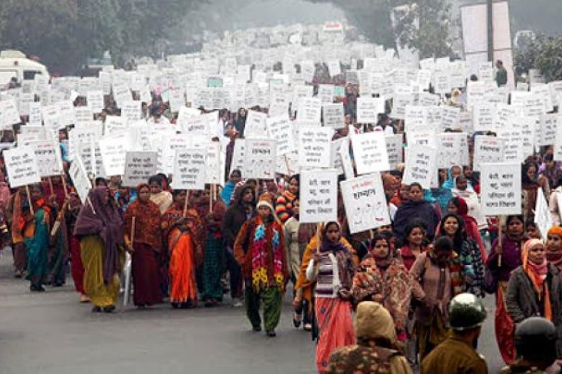 Hundreds of Indian women and men participate in peace march with placards carrying pro-women slogans in New Delhi. Photo: EPA