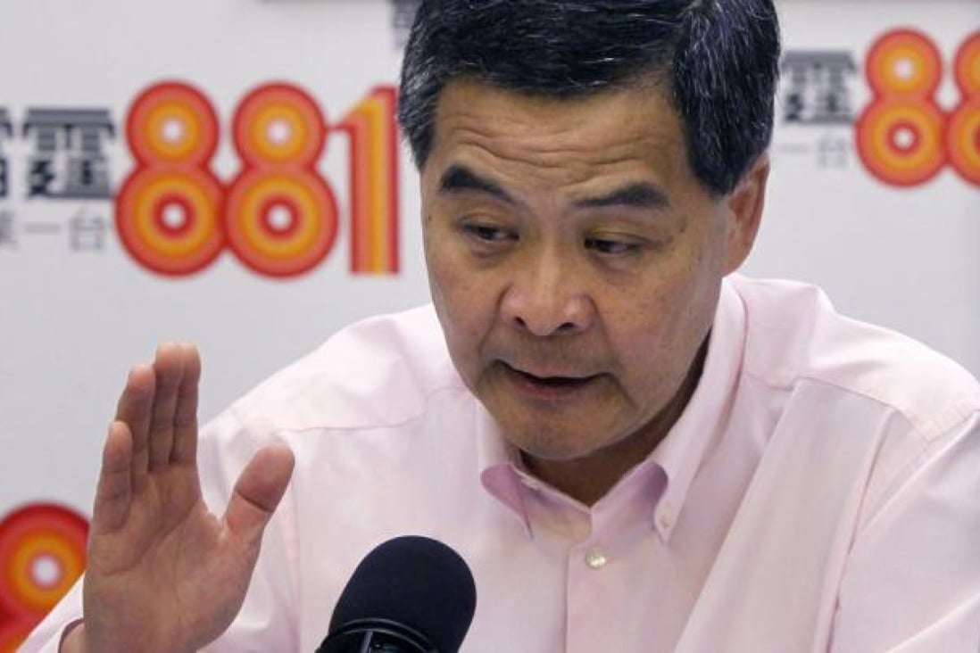 Chief Executive Leung Chun-ying warns that the government may impose a vacancy tax on unsold new homes to stop developer hoarding. Photo: David Wong