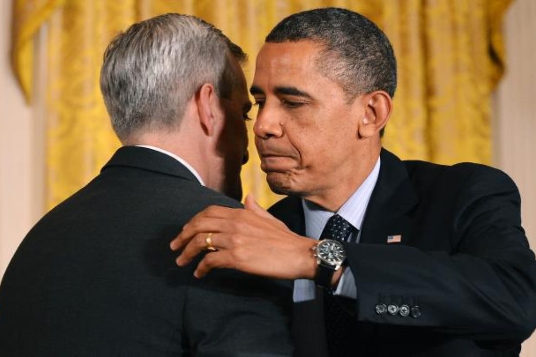 US President Barack Obama (right) embraces Denis McDonough. Photo: AFP