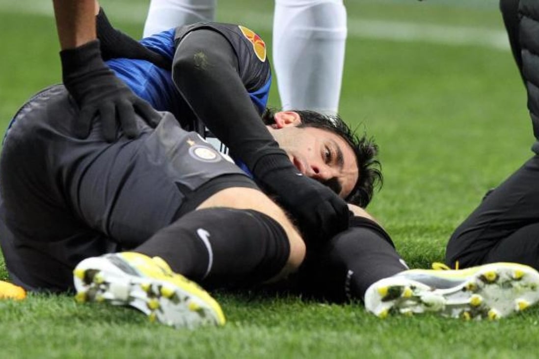 Inter's Diego Milito is hurt in a Europa League match. Photo: EPA