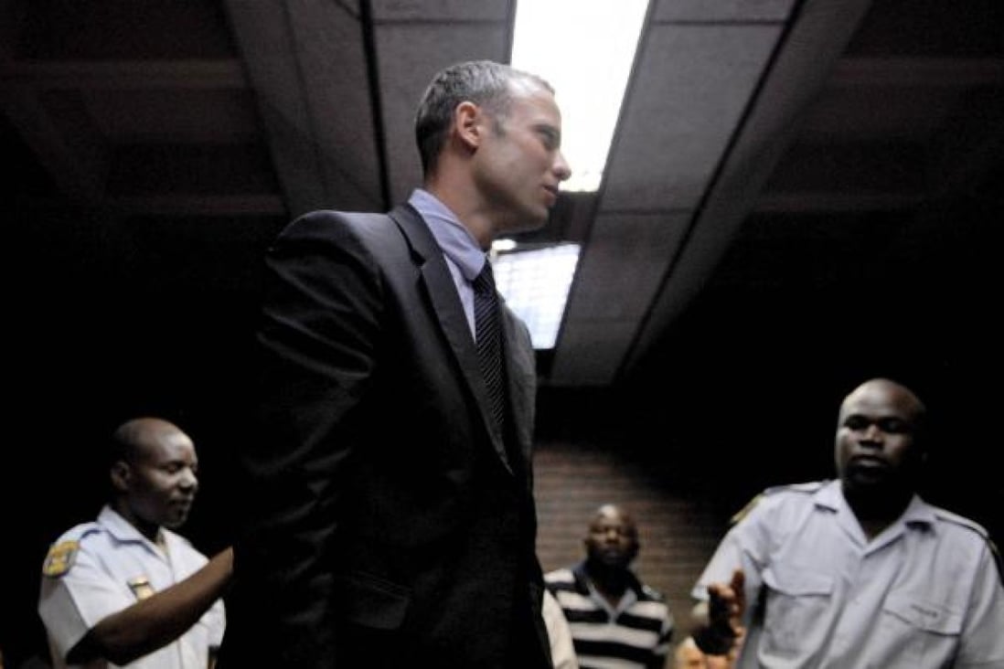 Oscar Pistorius was charged on Friday with the murder of 29-year-old Reeva Steenkamp. Photo: AFP