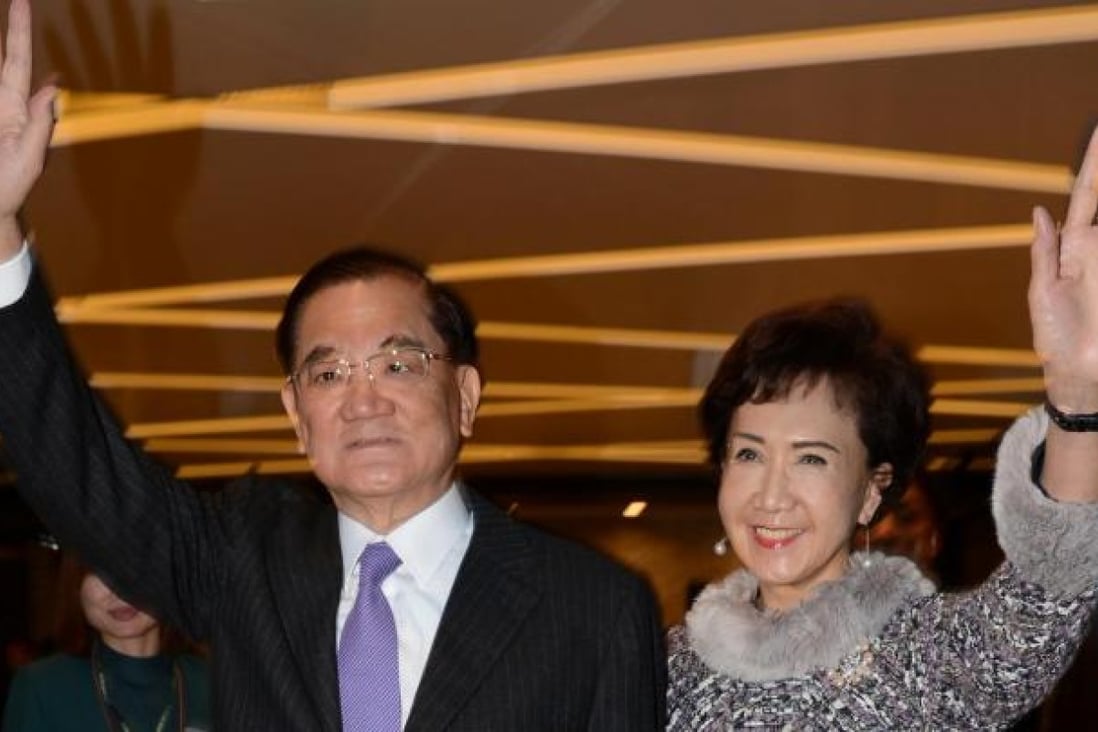 Lien Chan and his wife wave before leaving with a 30-strong delegation to Beijing. Photo: SCMP