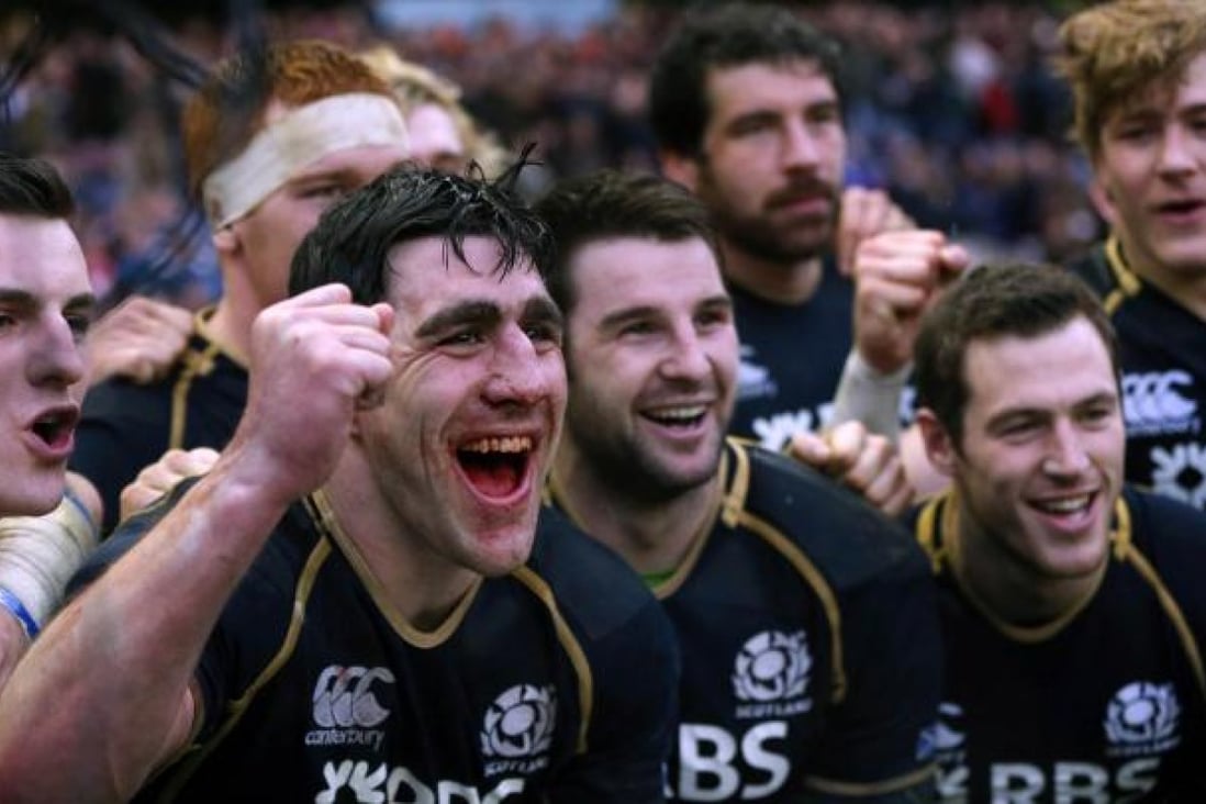 Scotland's captain Kelly Brown (left) celebrates with his teammates after their Six Nations win against Ireland in Edinburgh. Photo: AFP