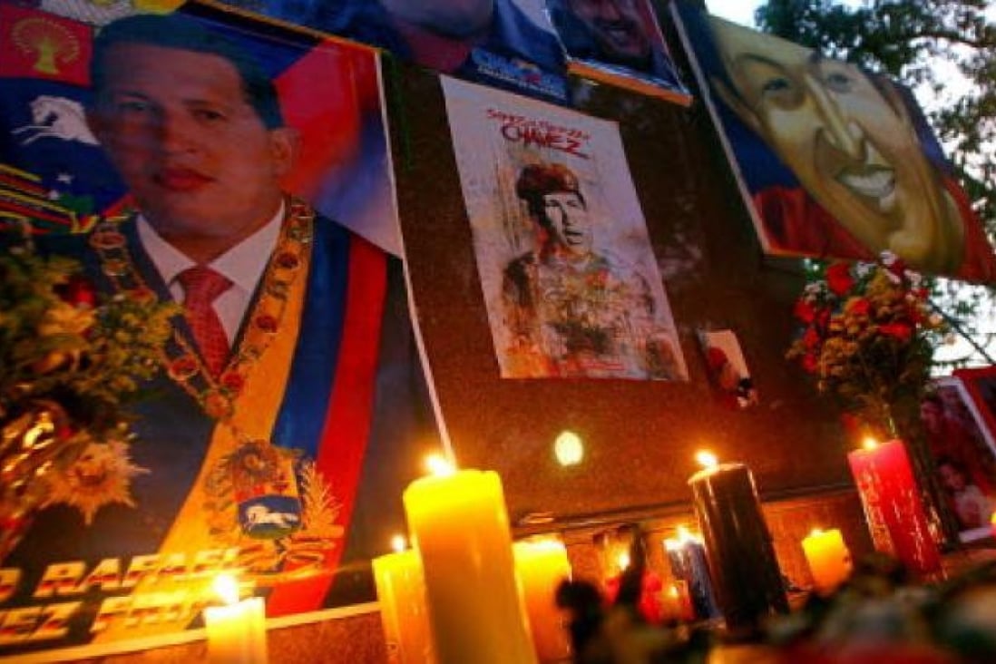 Sympathisers of late Venezuelan President Hugo Chavez light candles in an improvised altar set up at Simon Bolivar Square in Sabaneta, the town where Chavez was born. Photo: AFP