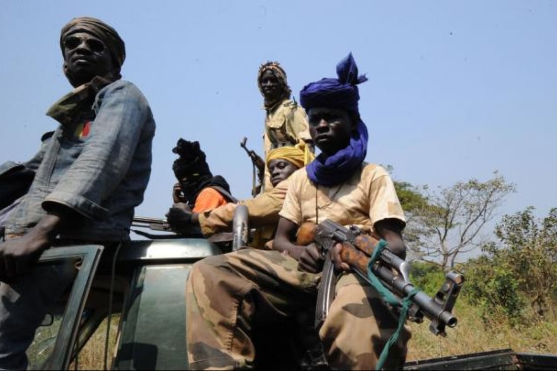 Rebels take up positions in a village 12 kilometres from Damara, where troops of the regional African force FOMAC are stationed. Photo: AFP