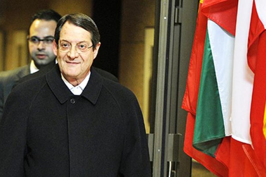 Cypriot President Nicos Anastasiades leaves following a Eurozone meeting on Monday at the EU Headquarters in Brussels. Photo: AFP