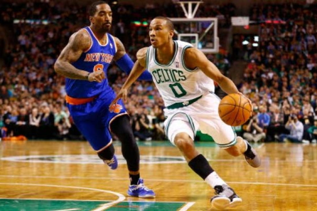 Avery Bradley #0 of the Boston Celtics drives to the basket past J.R. Smith #8 of the New York Knicks during the game  at TD Garden in Boston, Massachusetts. Photo: AFP