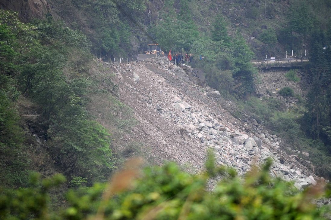 Rescuers work to clear the debris after landslides on the Guanyan Mountain section of the S210 highway in quake-hit Baoxing county, Sichuan province. Photo: Xinhua