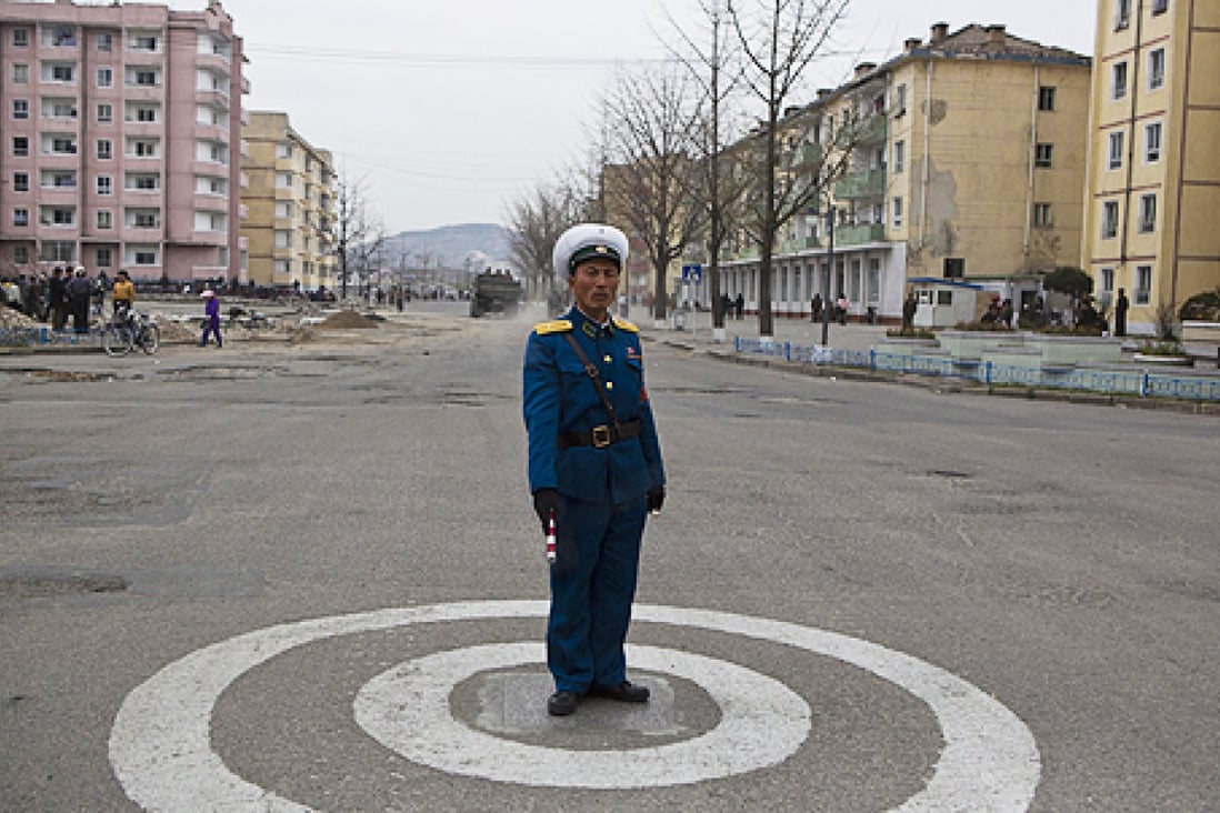 A North Korean traffic policeman stands at an intersection in Kaesong, North Korea. Photo: AP